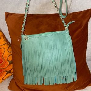 Fringe satchel, never been worn, still has tissue paper inside.